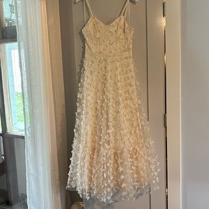 Brand new with tags attached. Size Medium Mable brand ivory gown w/butterflies